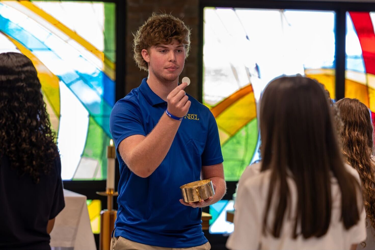 student offering communion